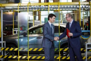 Toyota adds new Lexus crossover line at Canadian plant - Fred Volf shakes hands with bewildered Justin Trudeau