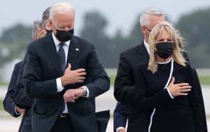 Joe Biden checks his watch during ceremony for Marines he helped Terrorist kill